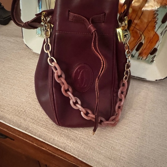 Elegant Cartier Burgundy Leather Bucket Bag with added Chain Detail